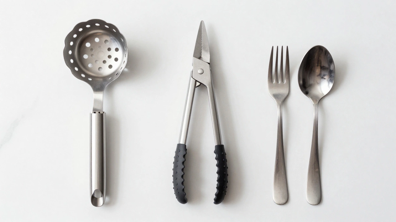 Pasta server, tongs, and fork-spoon set on marble